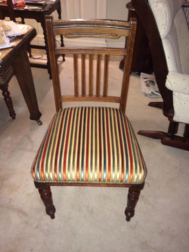 Wooden chair with striped upholstery