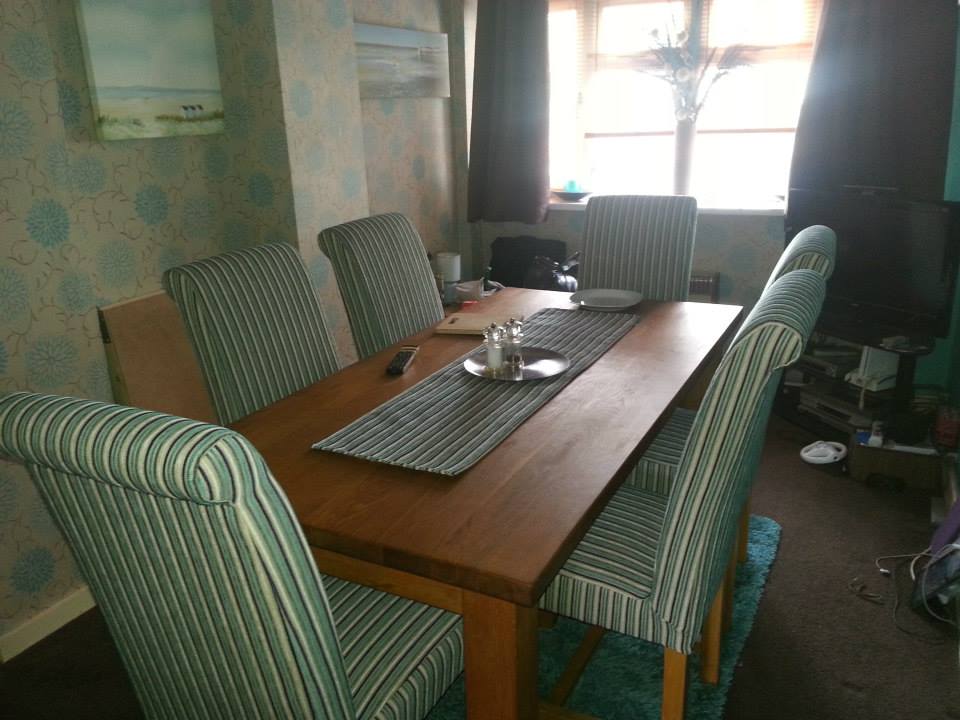 Dining room table with green chairs