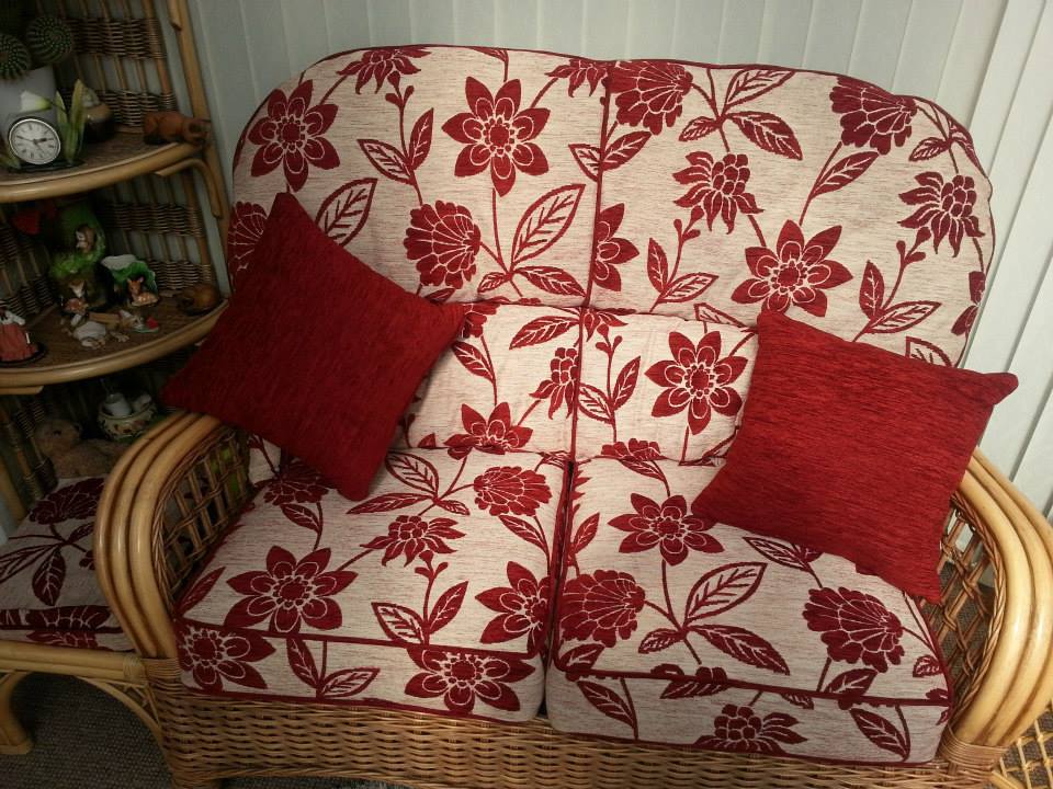 Red floral upholstery and red cushions