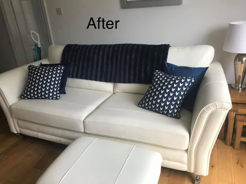 White sofa with blue cushions