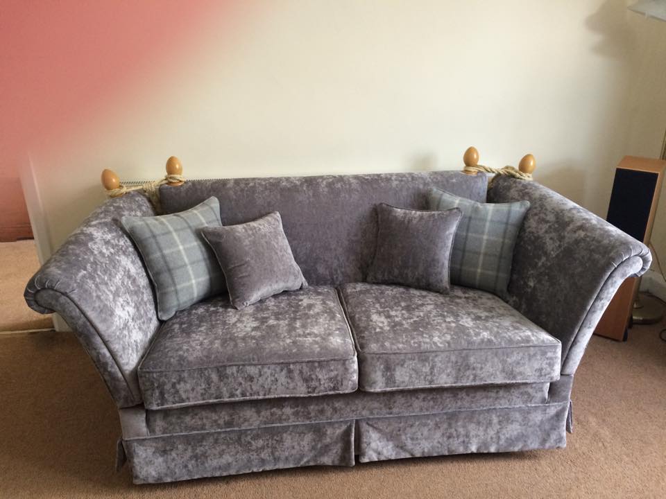 Dark grey sofa with matching cushions