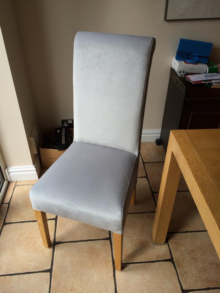 Dining room chair next to the corner of a wooden dining table