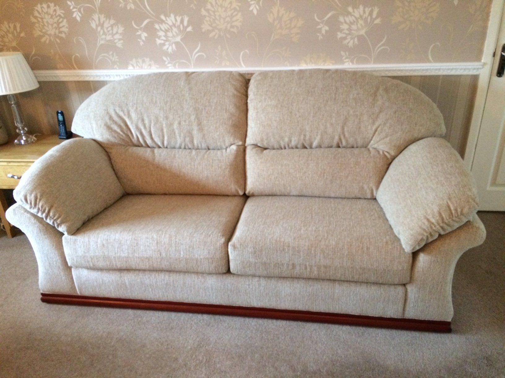 Cream sofa in a light coloured room