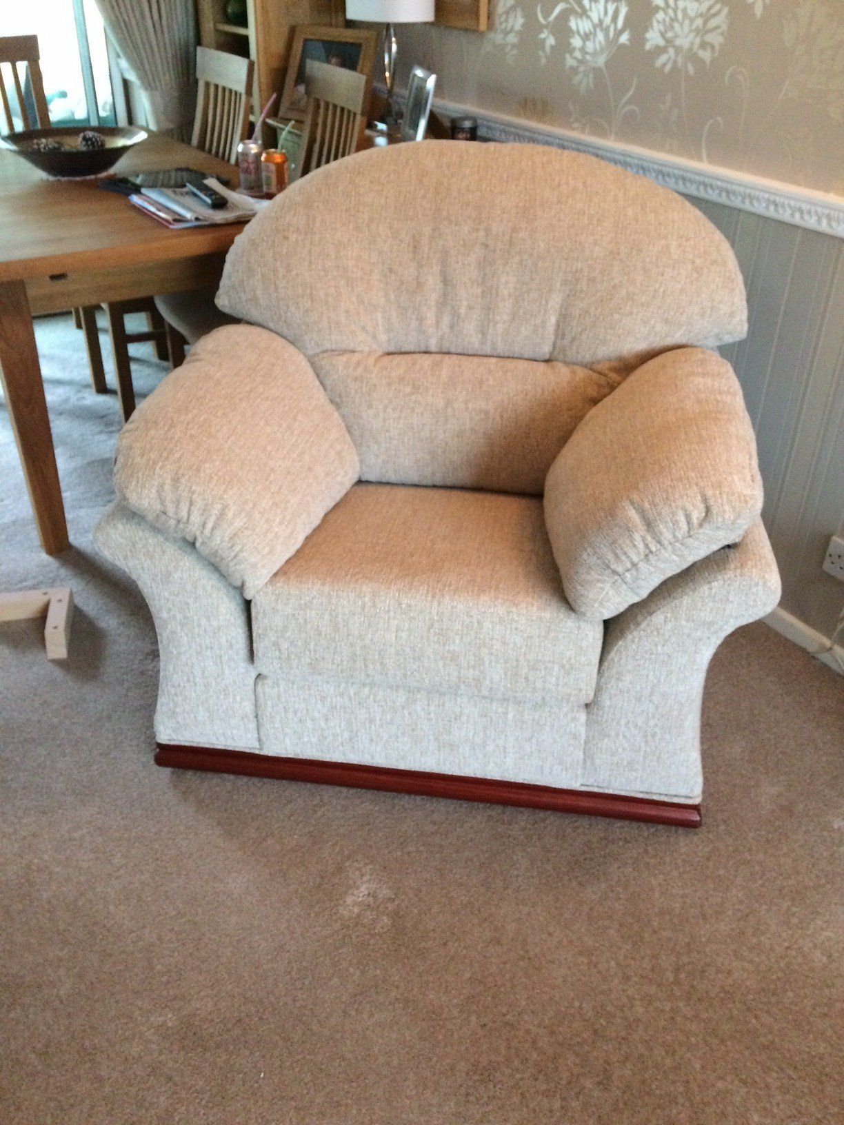 Cream armchair next to a side table