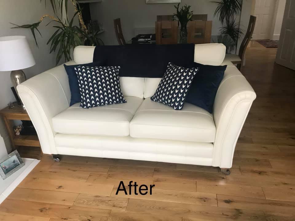 White sofa with various cushions