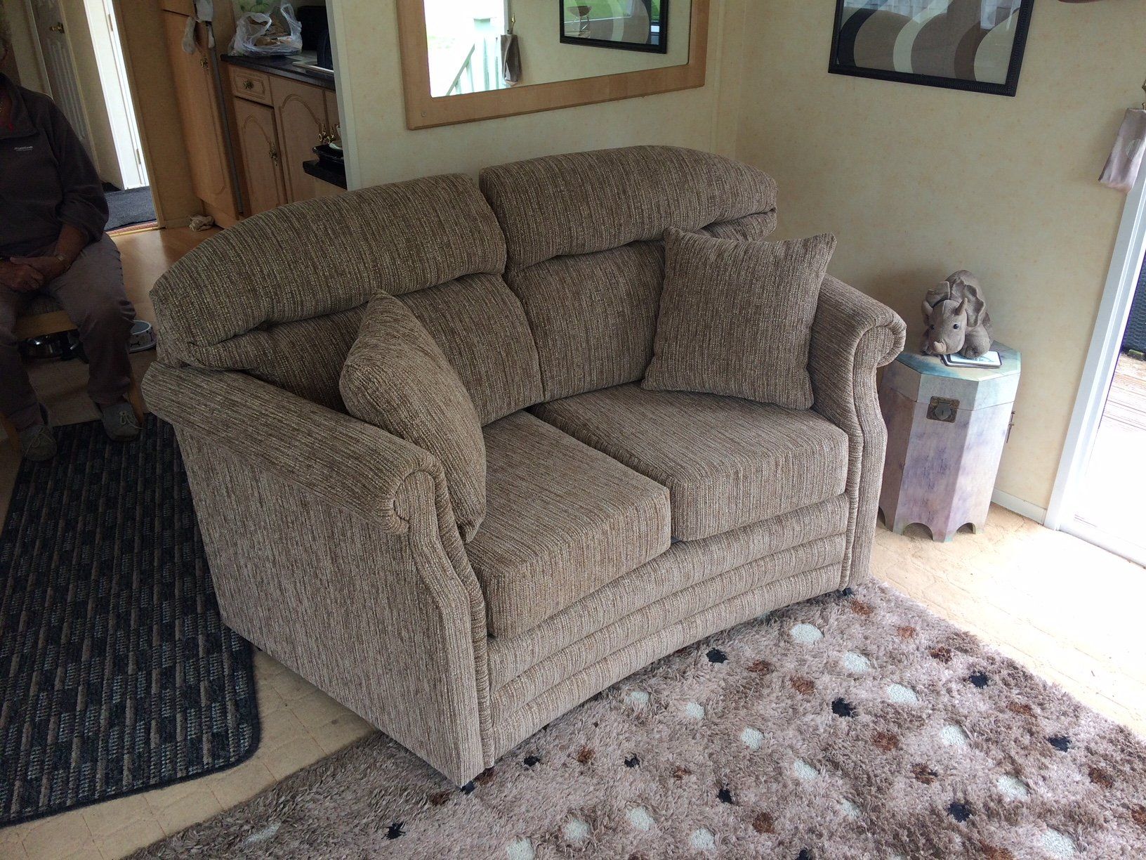 Small grey sofa on a carpet
