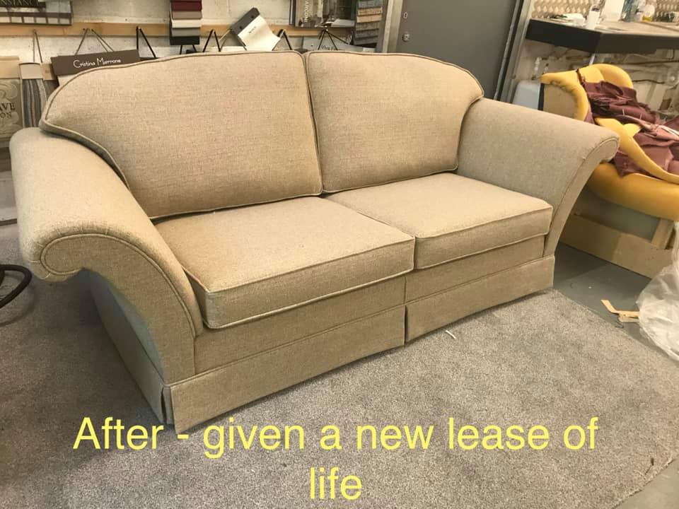 Beige upholstered sofa in a workshop