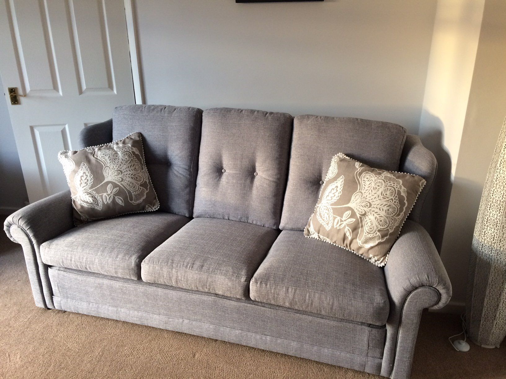 Grey sofa with cushions