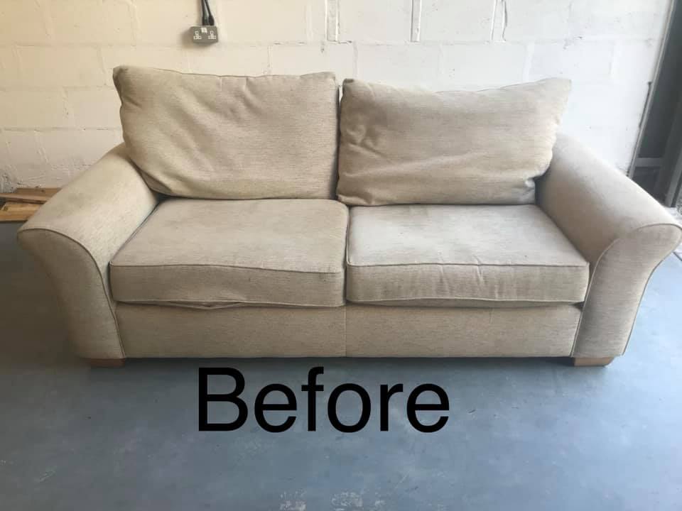 Old looking sofa on a blue carpet