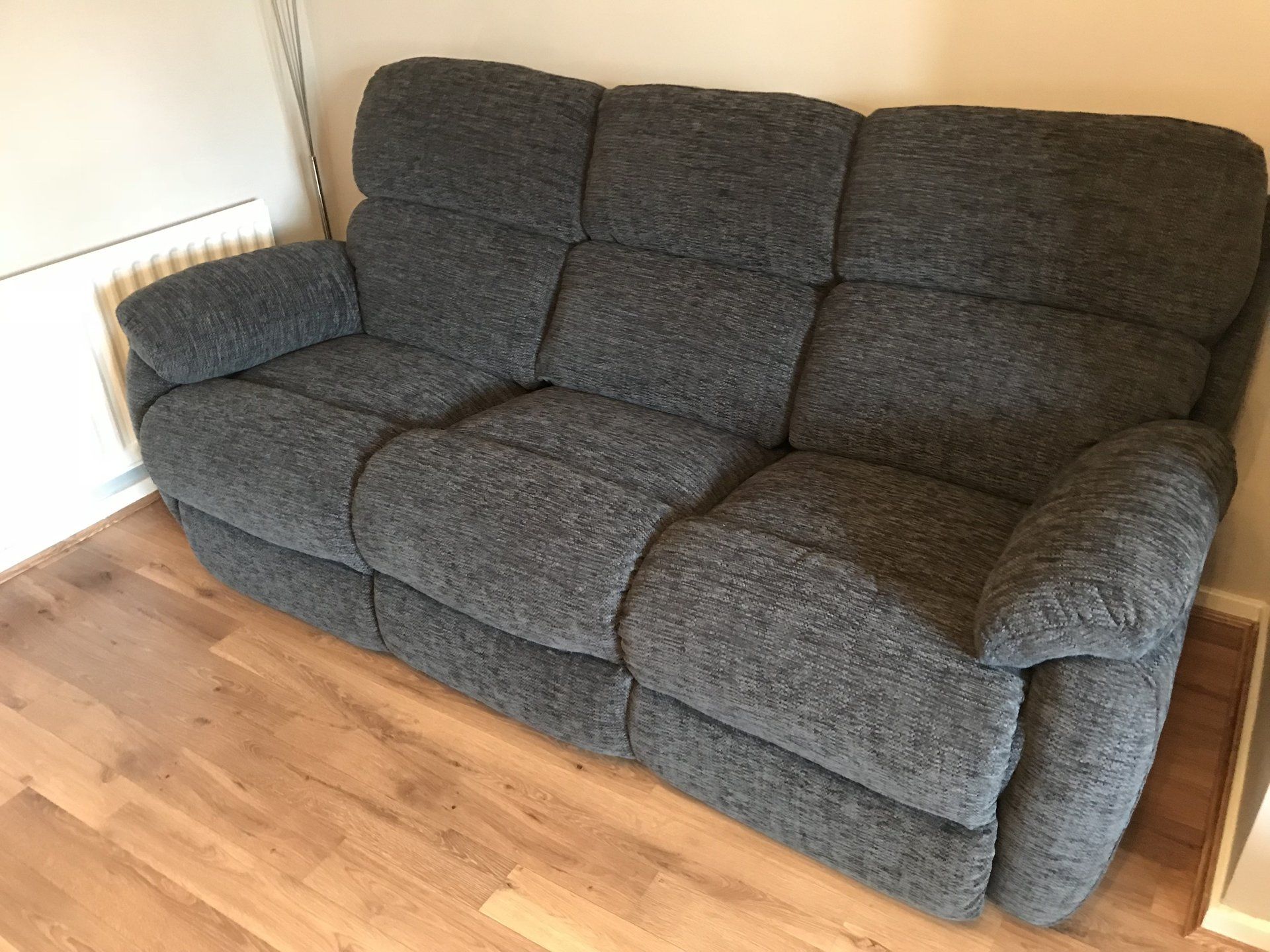 Side view of dark sofa in a room