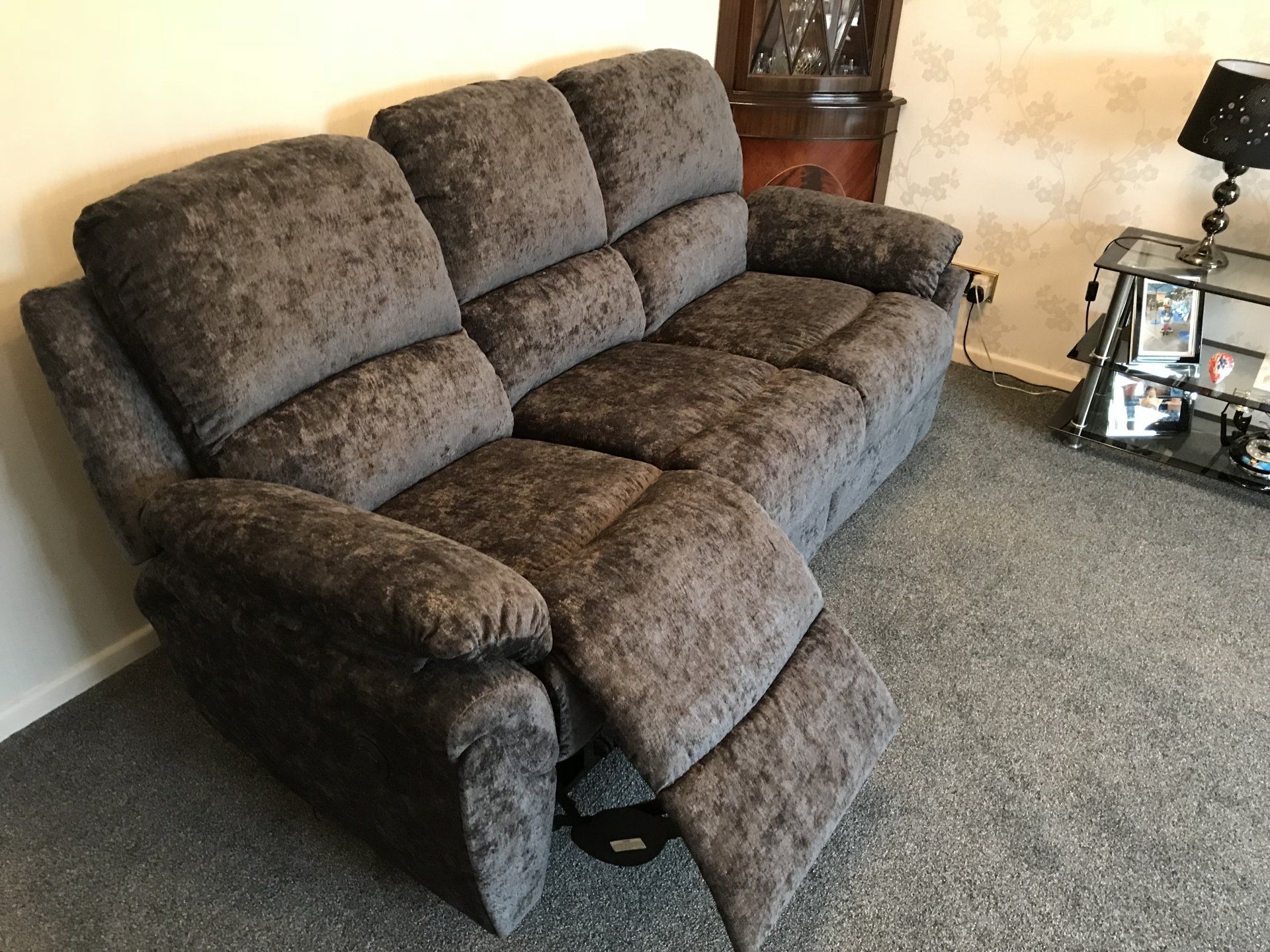 Dark coloured velvet sofa