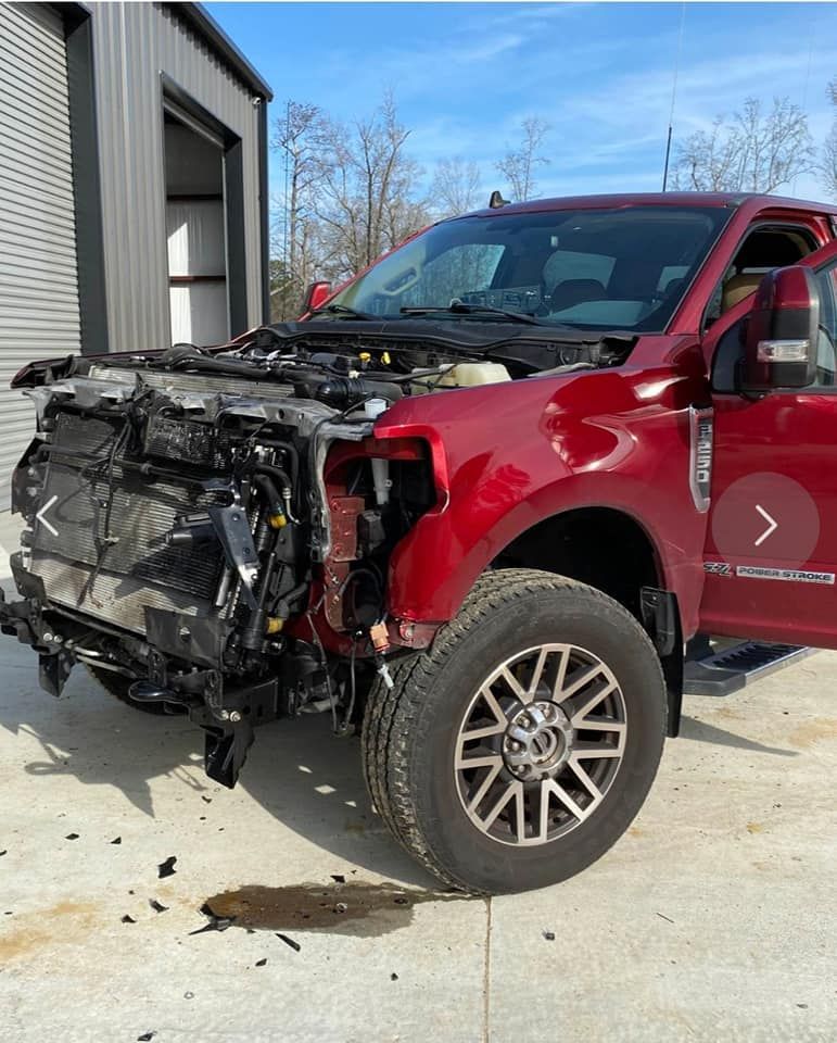 Ford truck missing front bumper.
