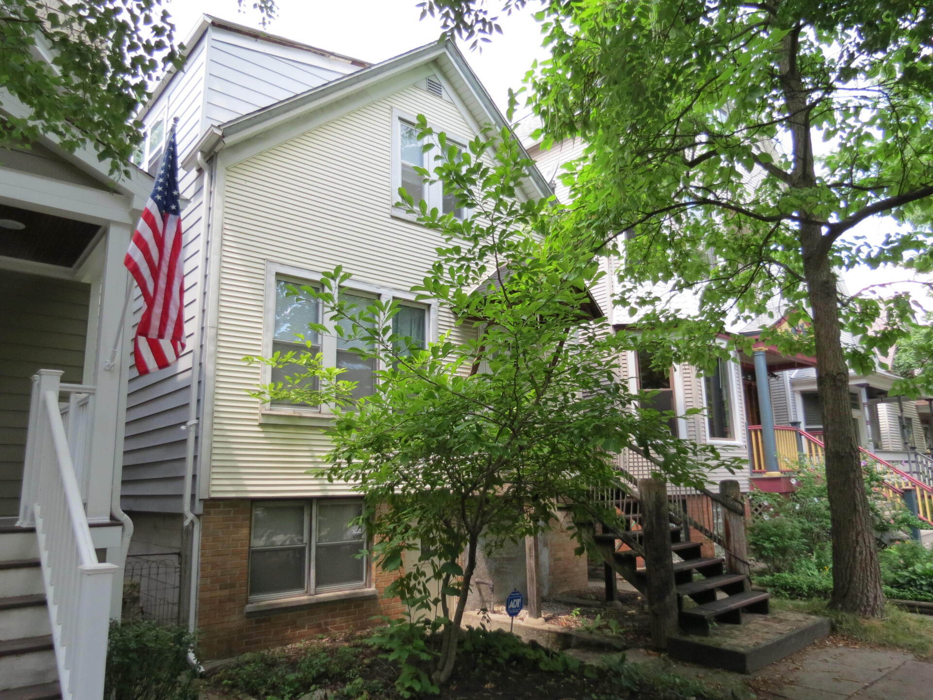 A house with an american flag on the side of it.