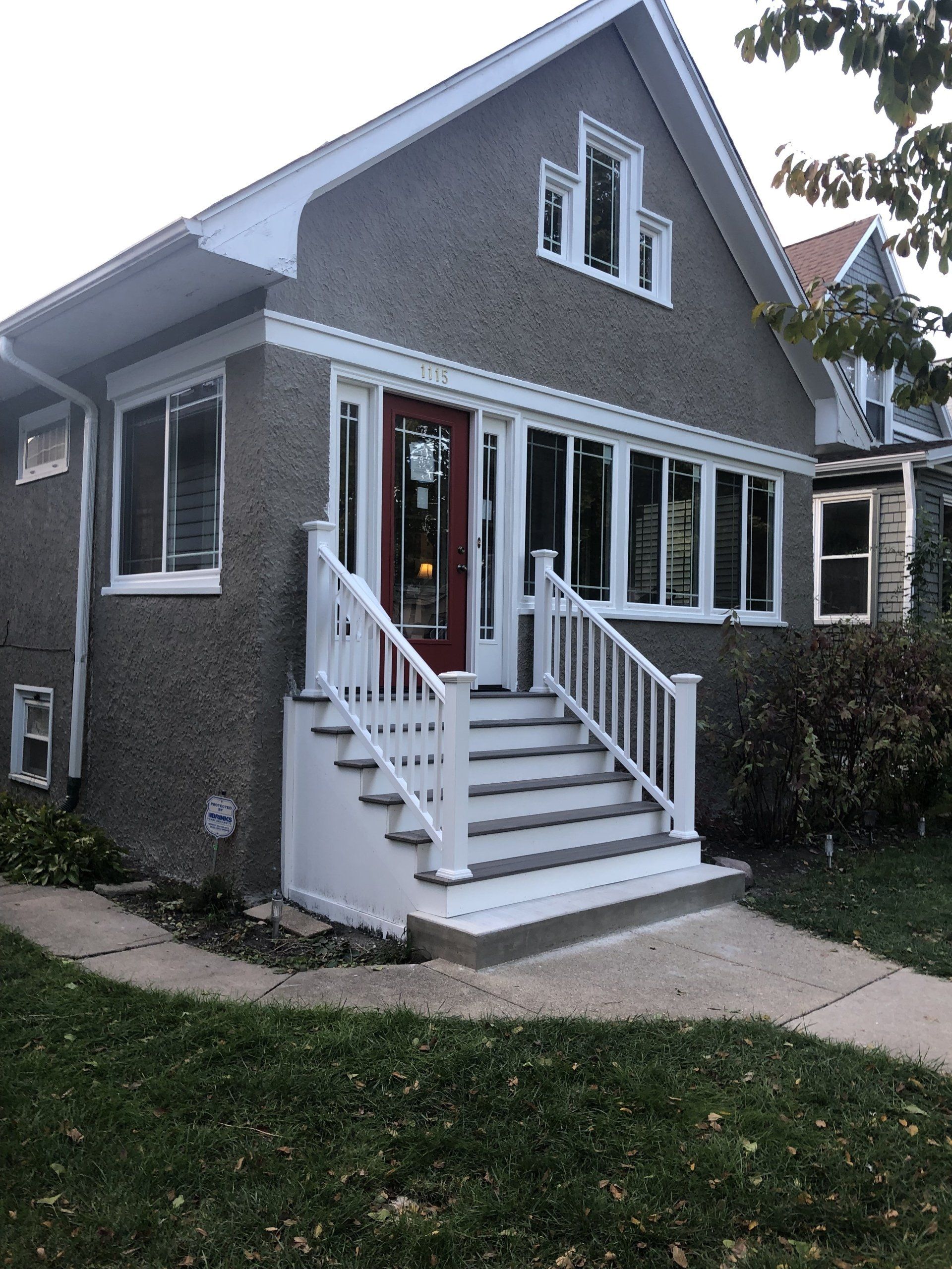 A house with stairs leading up to the front door