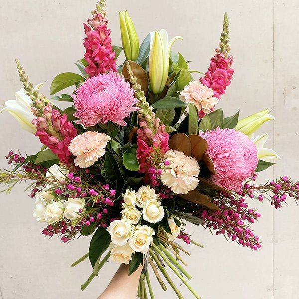 A Person Is Holding a Bouquet of Pink and White Flowers — Ivy Lane Flowers & Gifts in Nambour, QLD