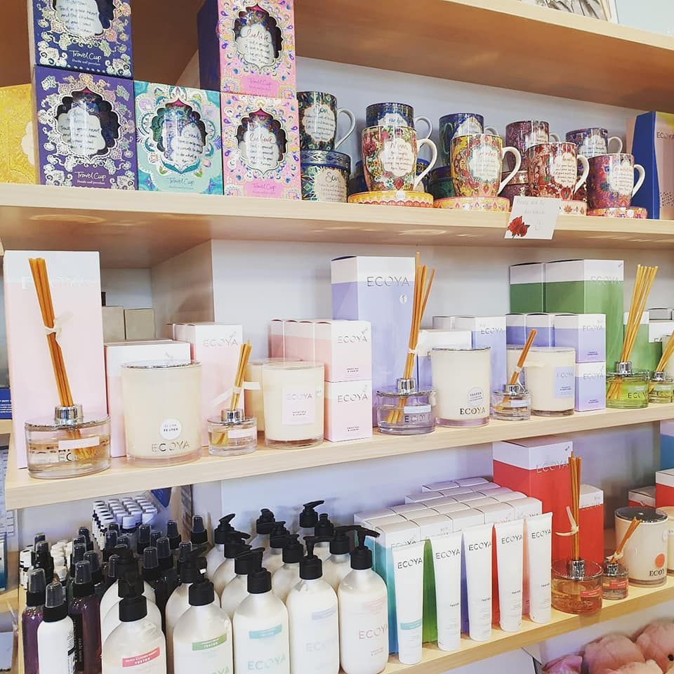 A Store Shelf Filled with Lots of Bottles and Candles — Ivy Lane Flowers & Gifts in Birtinya, QLD