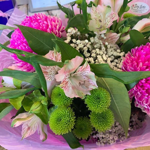 A Bouquet of Pink and Green Flowers Wrapped in Pink Paper — Ivy Lane Flowers & Gifts in Sunshine Coast, QLD