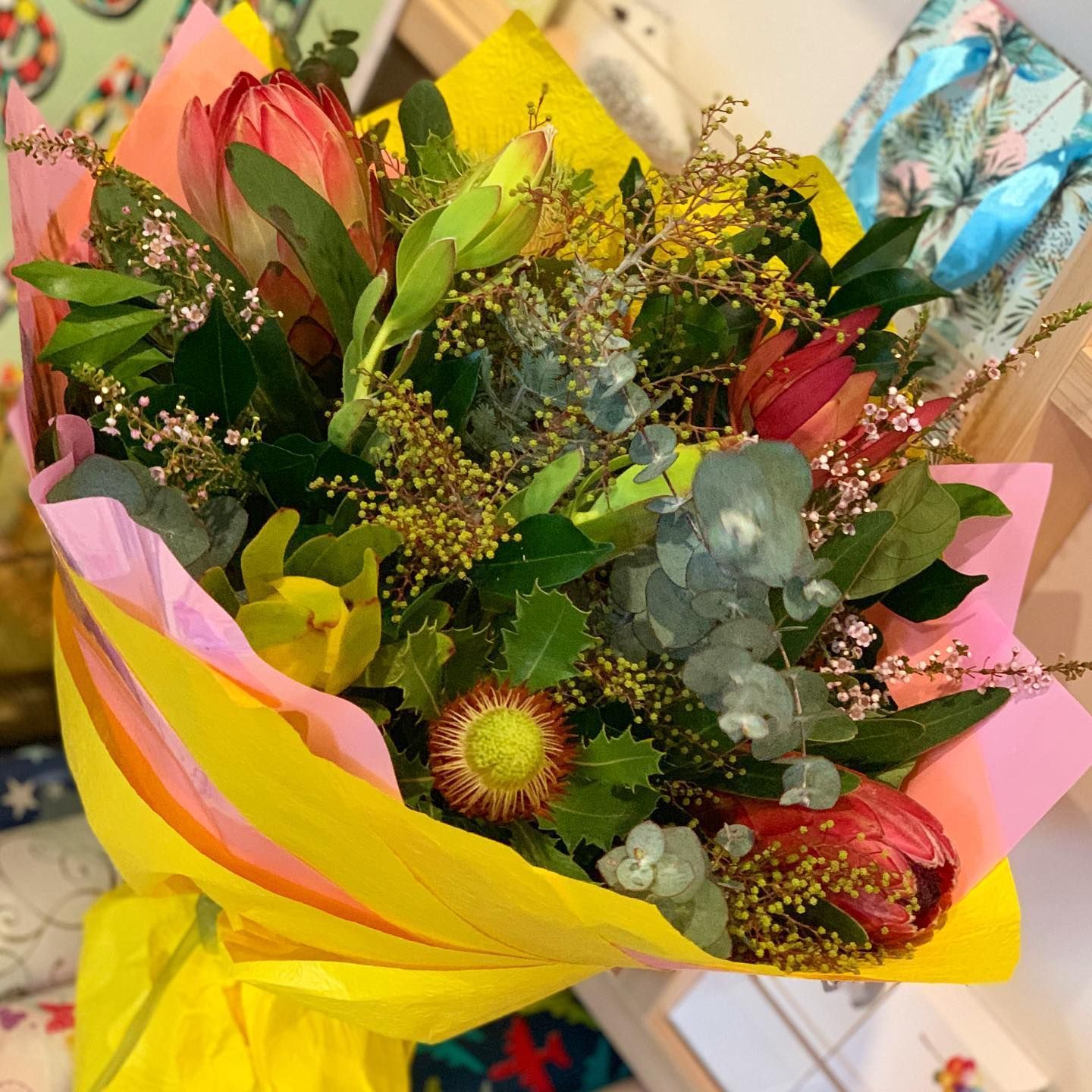 Bouquet of Red and Yellow Flowers With Green Foliage Wrapped — Ivy Lane Flowers & Gifts in Birtinya, QLD