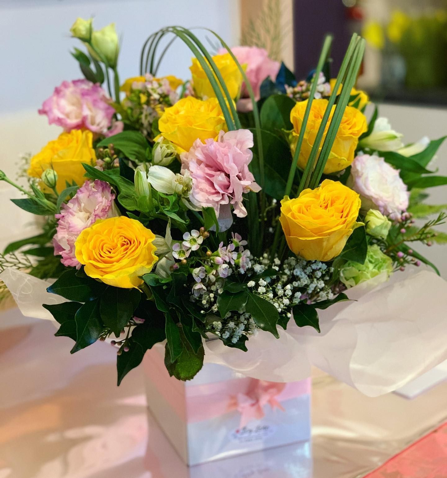 Bouquet of Yellow Roses, Pink Flowers, and Greenery in a Decorated Box — Ivy Lane Flowers & Gifts in Birtinya, QLD