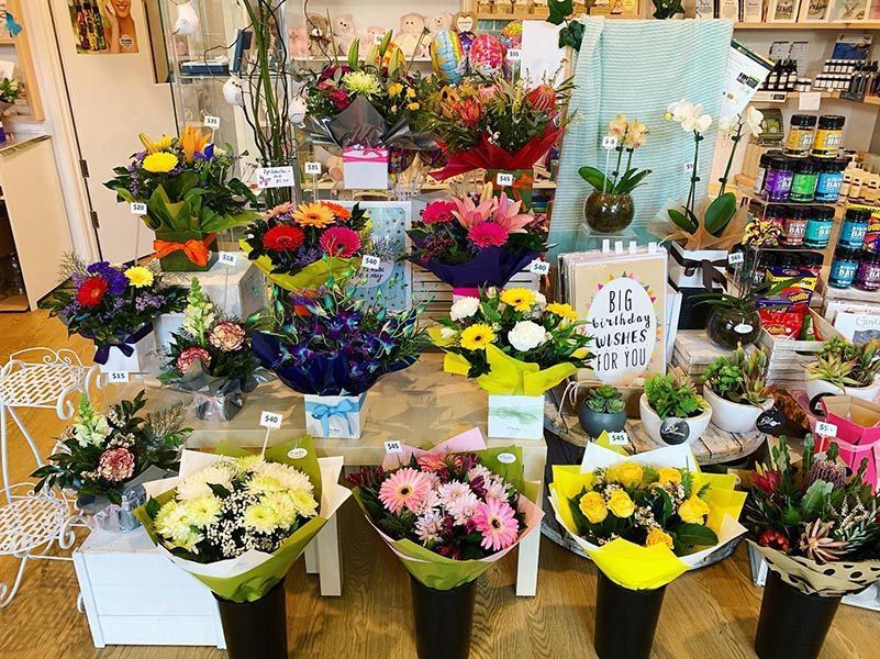 A Bunch of Flowers Are Sitting on A Table in A Store — Ivy Lane Flowers & Gifts in Sunshine Coast, QLD