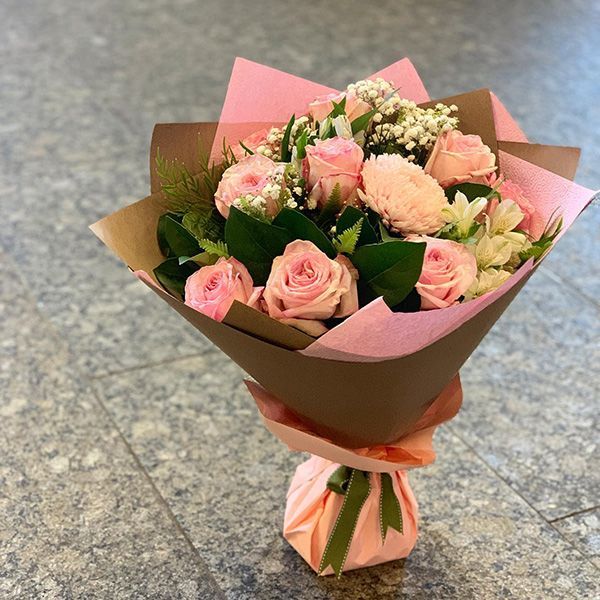 A Bouquet of Pink Roses Wrapped in Pink Paper — Ivy Lane Flowers & Gifts in Maroochydore, QLD
