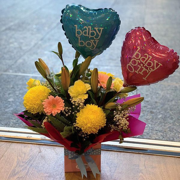 A Bouquet of Flowers with Balloons that Say Baby Boy and Baby Girl — Ivy Lane Flowers & Gifts in Maroochydore, QLD