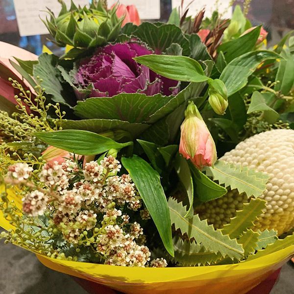 A Bouquet of Flowers Is Wrapped in Yellow Paper — Ivy Lane Flowers & Gifts in Buderim, QLD