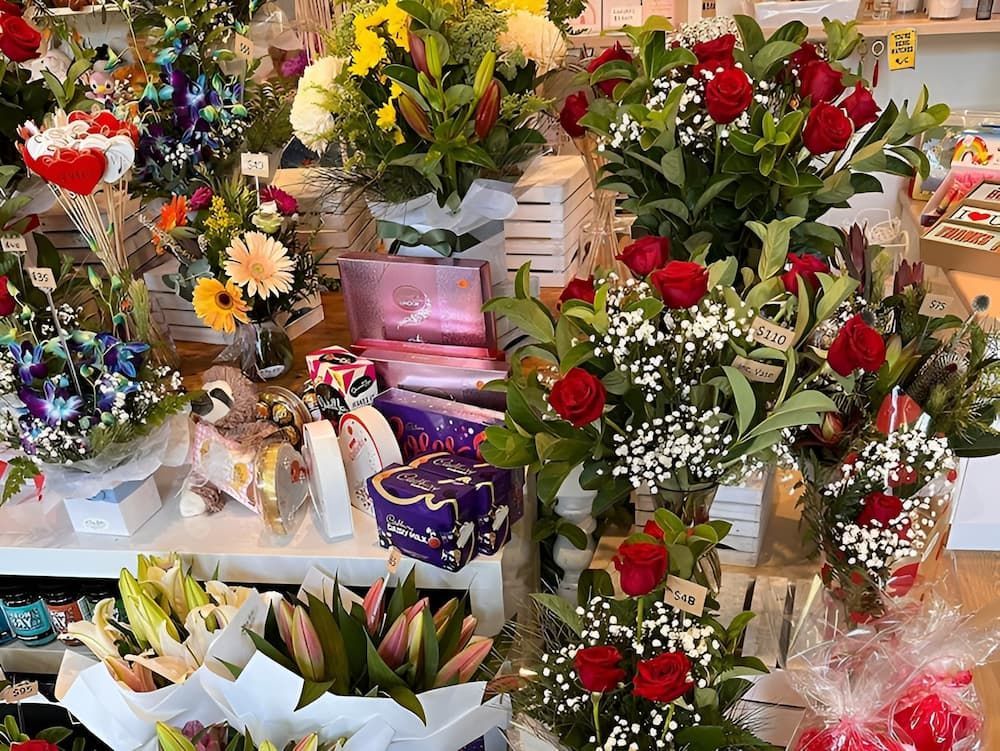 A Bunch of Flowers Are Sitting on A Table in A Store — Ivy Lane Flowers & Gifts in Birtinya, QLD