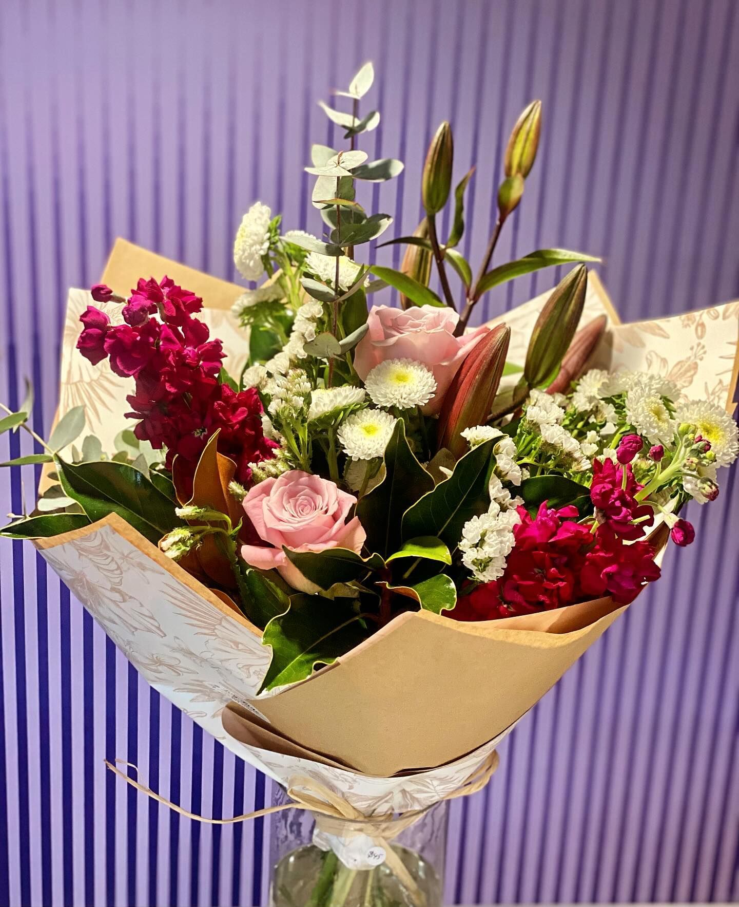 Bouquet of Pink Roses, Lilies, and Red Flowers Wrapped in Paper — Ivy Lane Flowers & Gifts in Birtinya, QLD