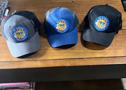 Three trucker hats, grey, blue, and black, with a smiling sun logo on the front.