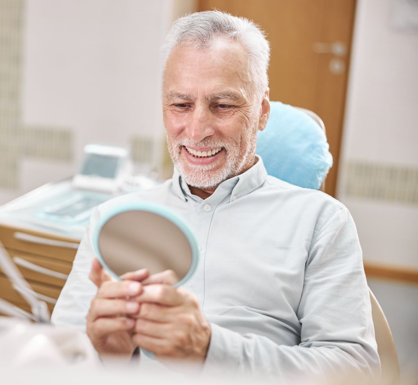 Old man smiling after restorative dental care | Natural dentist for crowns and bridges