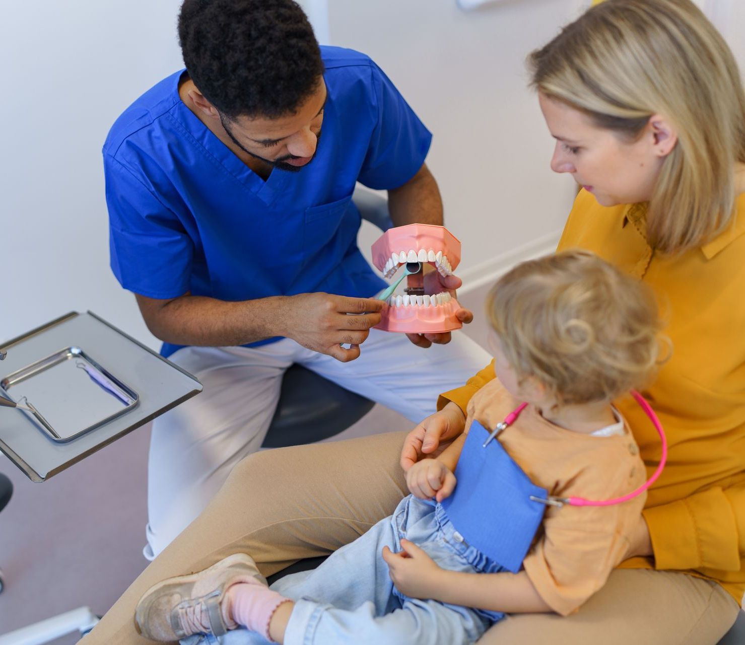 Dentist teaching teeth cleaning and brushing to mom and child | Family dentist with holistic approach | Somerset NJ