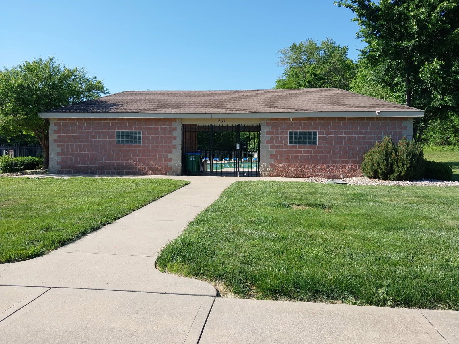 A brick building with a walkway leading to it