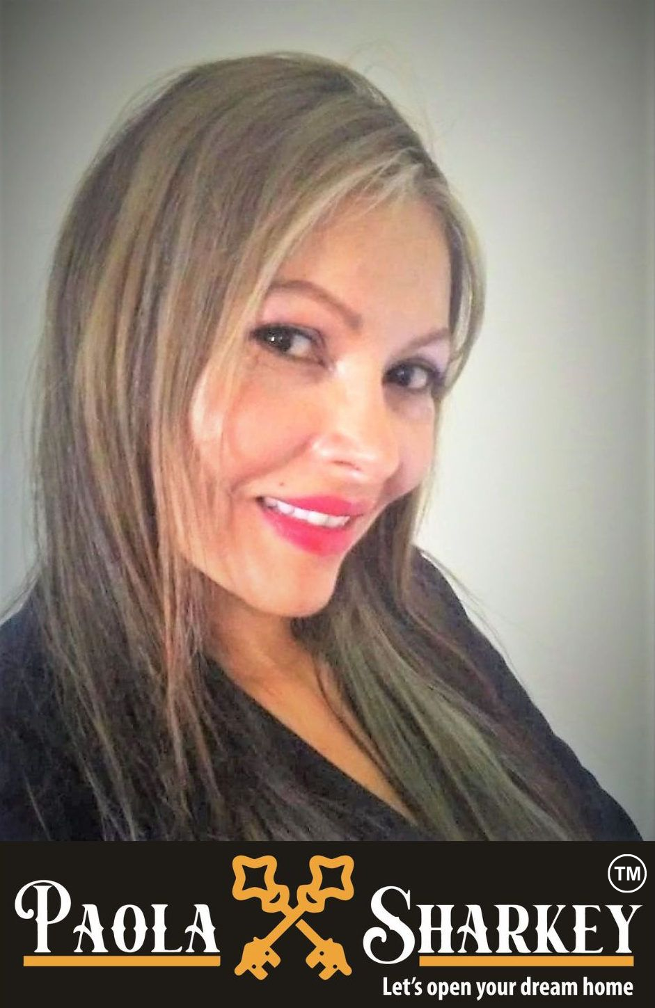 Woman smiling, dark blazer, blonde hair, real estate agent Paola Sharkey, logo: keys, 