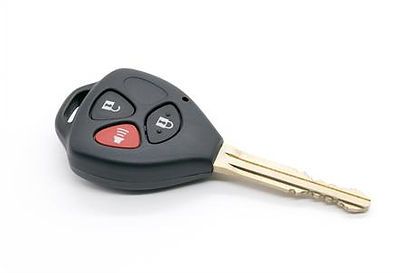 A car key with a remote control on a white background.