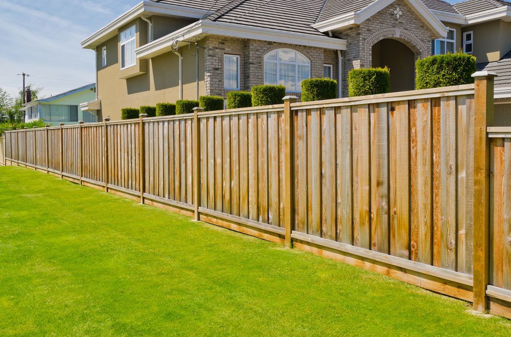 Wooden Fence Surrounding a Luxury Home — Fencer in Wauchope, NSW