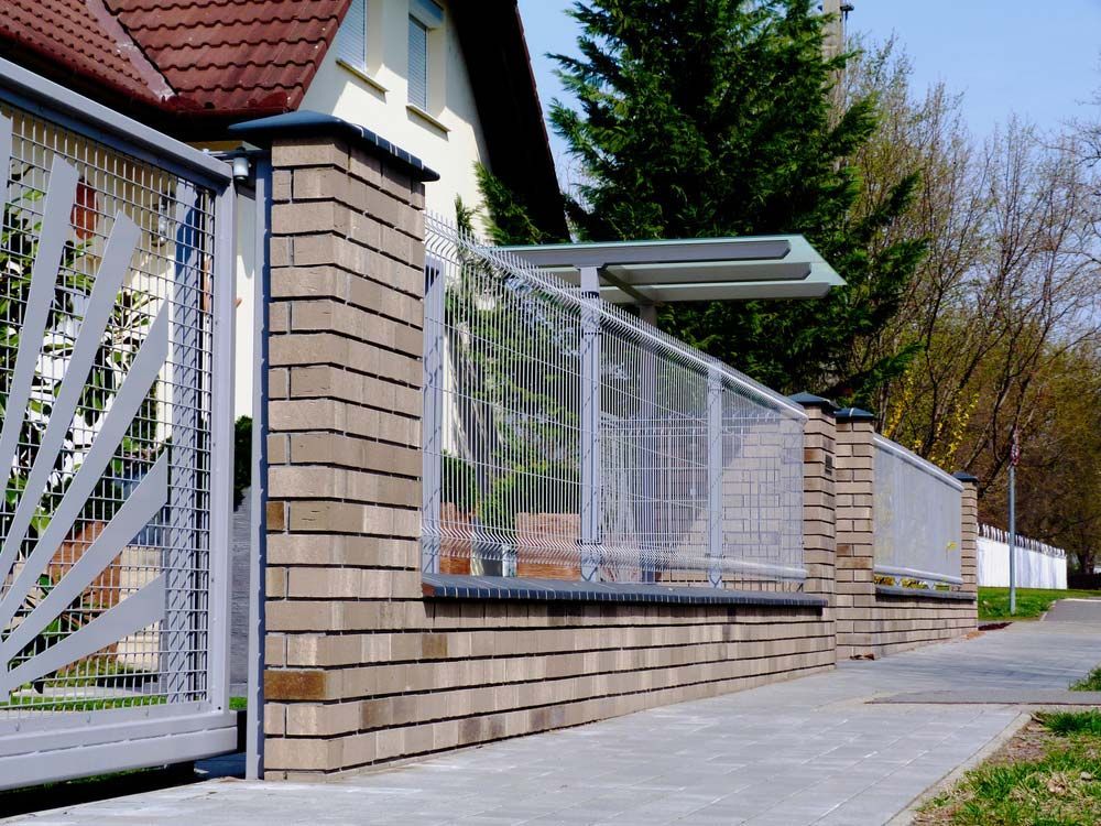 Wiremesh Fence With Brick Pillars — Fencer in Wauchope, NSW