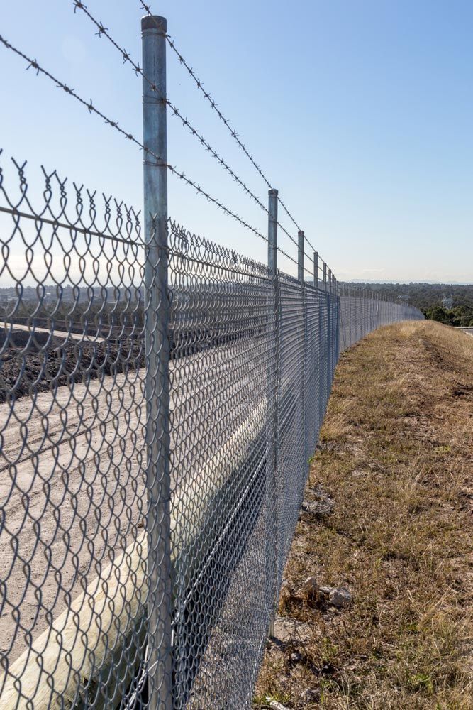 Chainwire Fence Surrounding a Work Site — Fencer in Crescent Head, NSW