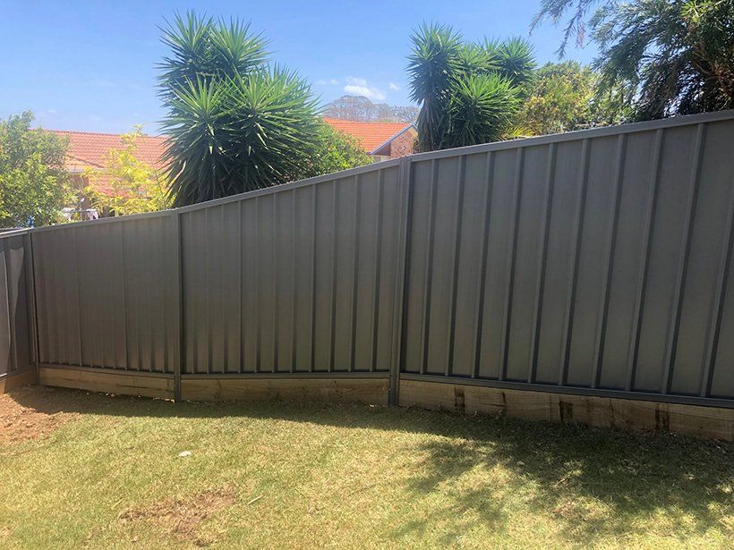 Grey Colorbond And Wood Fence — Colorbond Fencing in Temagog, NSW