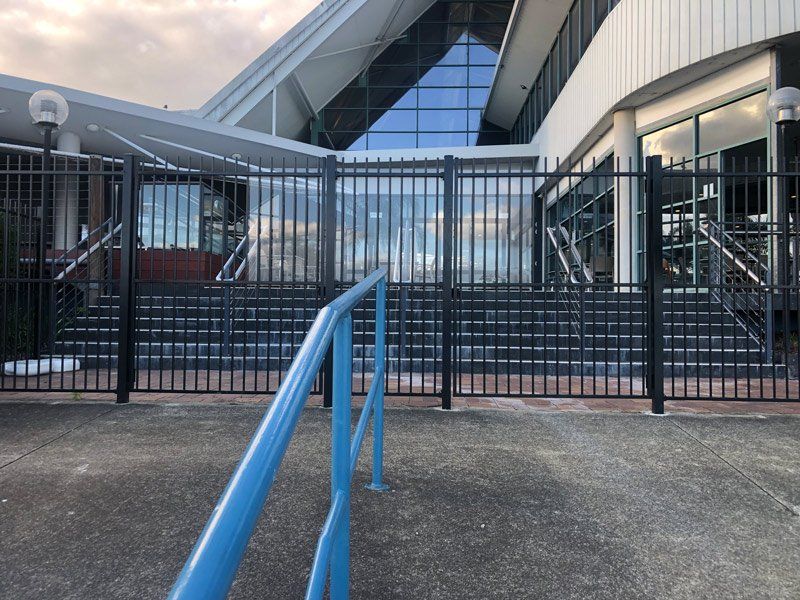 Steel Fence And Blue Rail — Pool Fencing in Temagog, NSW
