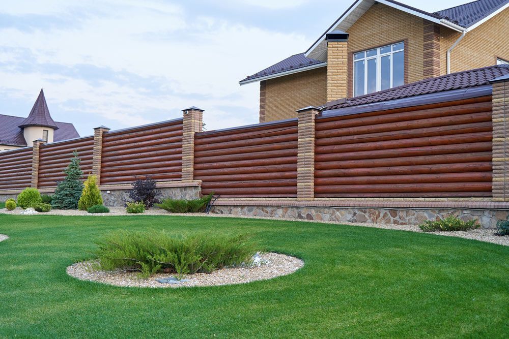 Stylish Decorative Fence Around a Large Home — Fencer in Wauchope, NSW