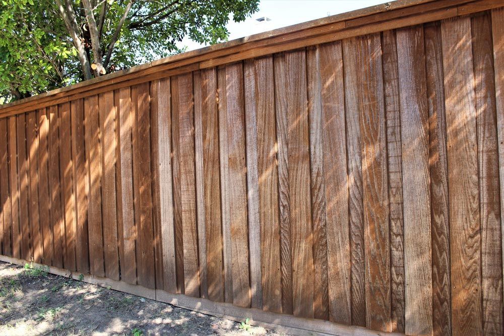 Board On Board Wooden Fence Shows Signs Of Wear And Tear — Fencer in Port Macquarie, NSW