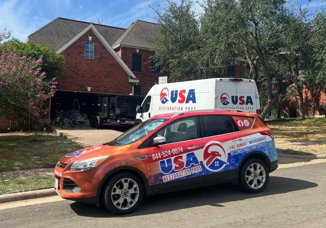 A usa van is parked in front of a brick house.