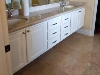 bathroom with white cabinets