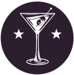 Cocktail glass with olives and stars on a dark purple background.