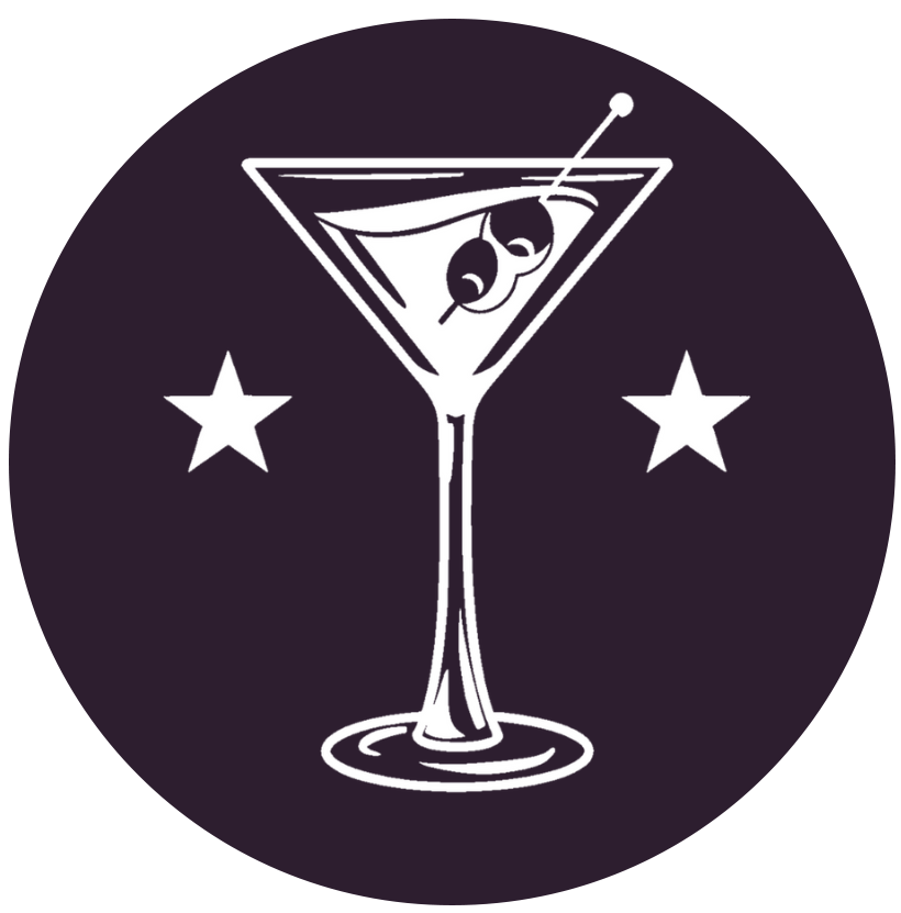 Martini glass with olives, inside a purple circle with stars.