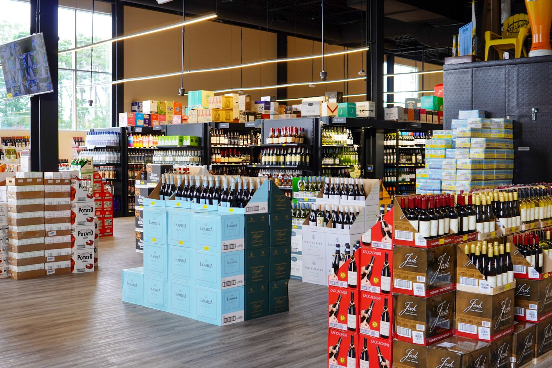 A grocery store filled with lots of bottles of wine