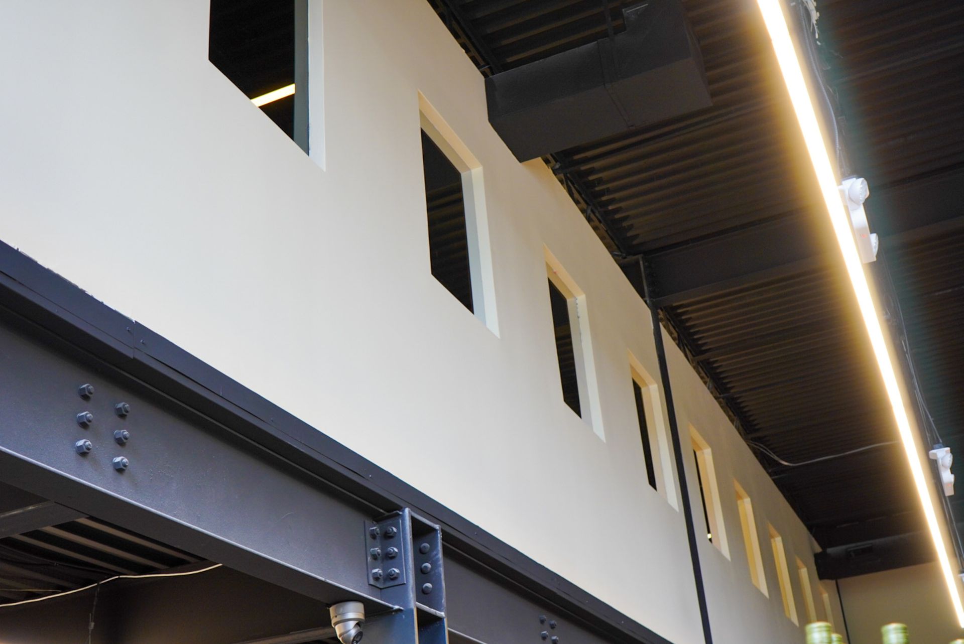 A building with a lot of windows and a ceiling