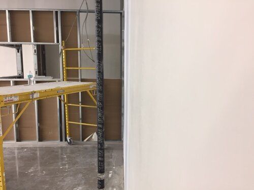 A room with a scaffolding in the middle of it