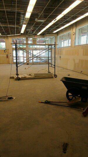 There is a wheelbarrow in the middle of the room.